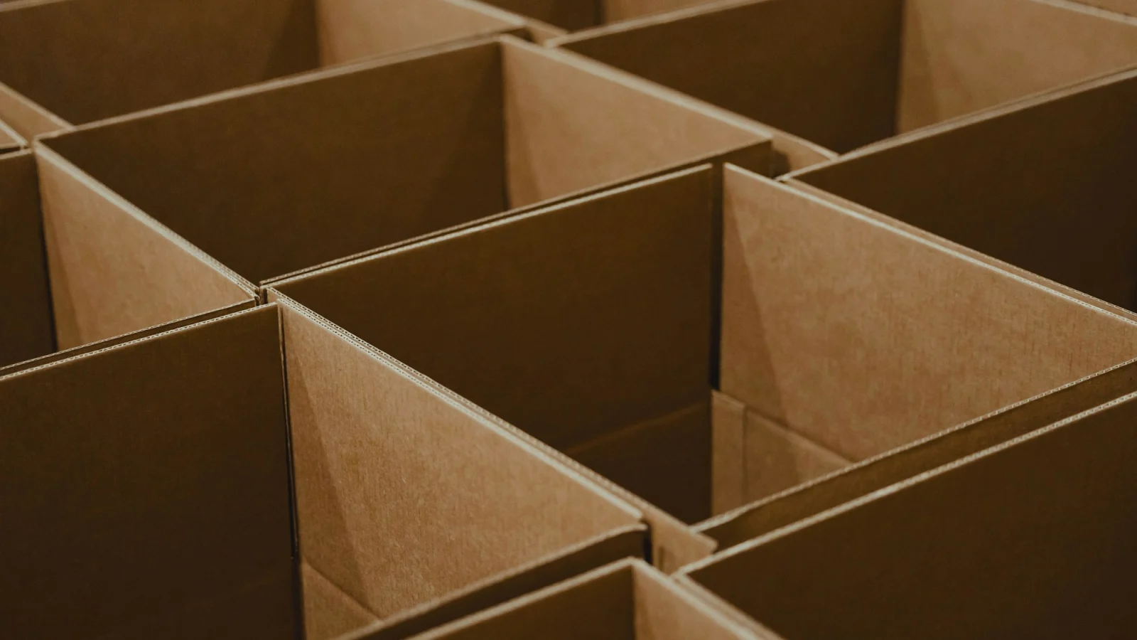 A lot of brown boxes that are open
